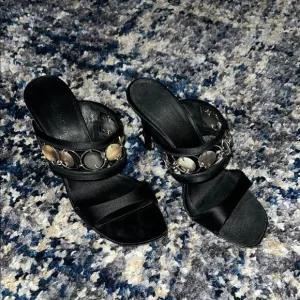 Calvin Klein Black Heeled Sandals with Strappy Design