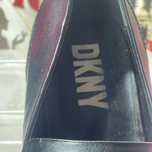 DKNY Black Slip On Loafers br With‎ silver buckle logo, women's size 11