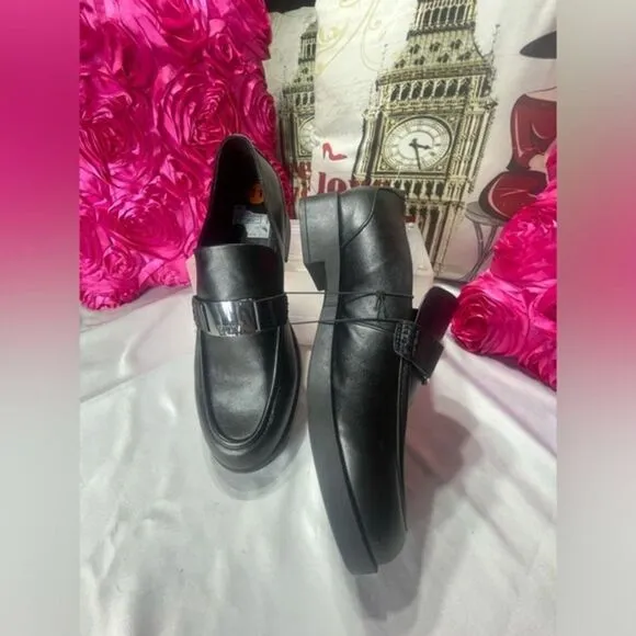 DKNY Black Slip On Loafers br With‎ silver buckle logo, women's size 11