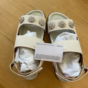 Ganni Cream Sandals with Metallic Embellishments