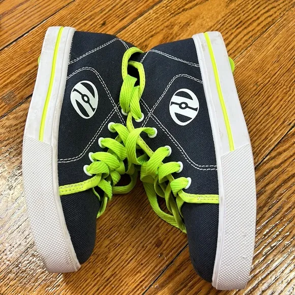 Heely’s brand canvas blue/green wheeled shoes. Youth size 4. Excellent condition