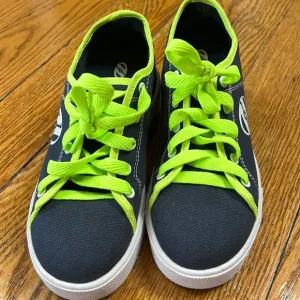 Heely’s brand canvas blue/green wheeled shoes. Youth size 4. Excellent condition