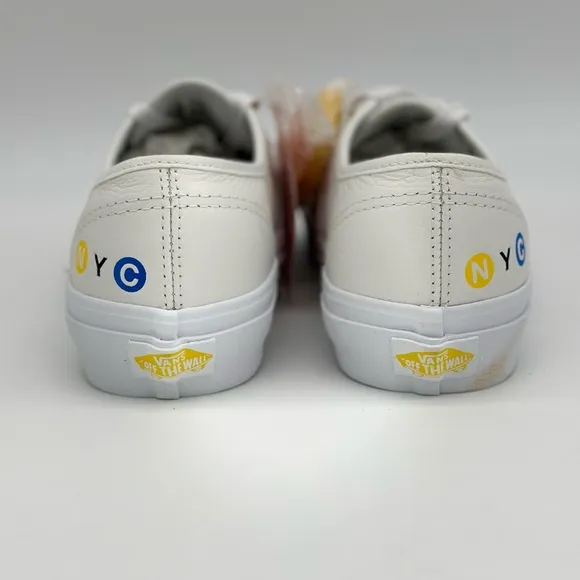 Vans White Canvas Sneakers with Gold Eyelets