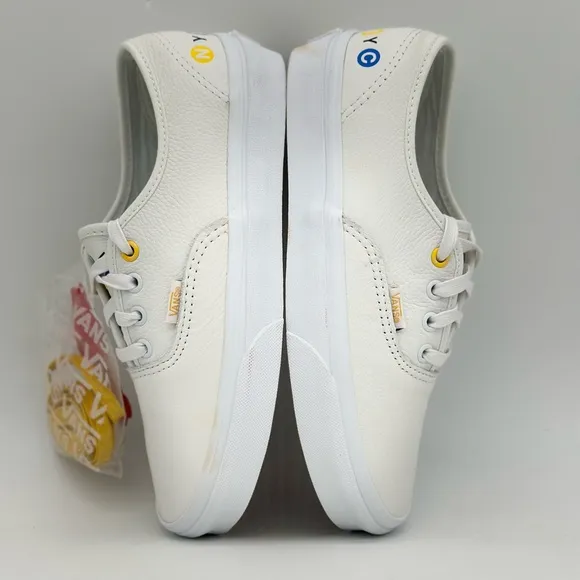 Vans White Canvas Sneakers with Gold Eyelets