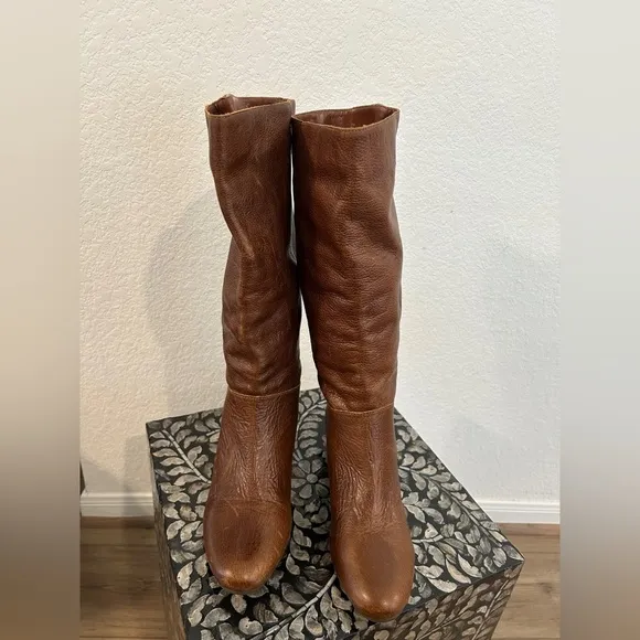 Whiskey Brown leather knee-high riding boots with a buckle to adjust calf