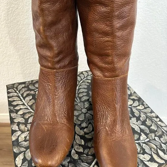 Whiskey Brown leather knee-high riding boots with a buckle to adjust calf