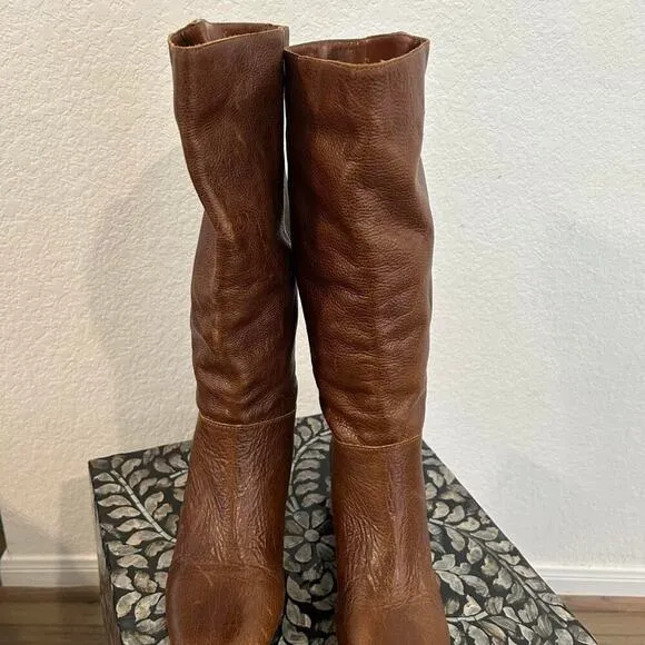 Whiskey Brown leather knee-high riding boots with a buckle to adjust calf