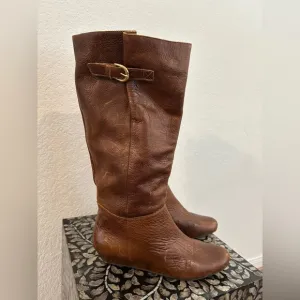 Whiskey Brown leather knee-high riding boots with a buckle to adjust calf