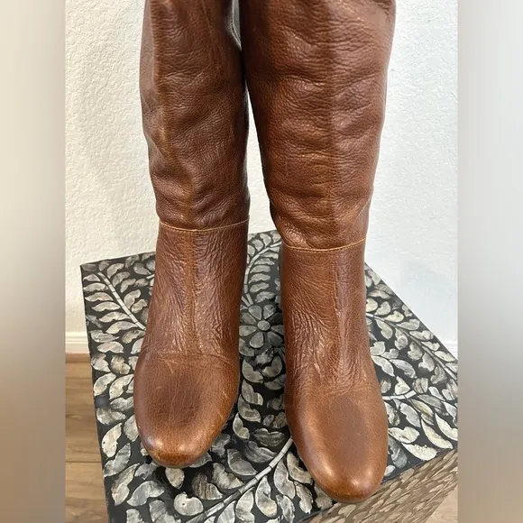 Whiskey Brown leather knee-high riding boots with a buckle to adjust calf