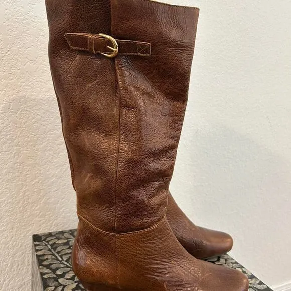 Whiskey Brown leather knee-high riding boots with a buckle to adjust calf
